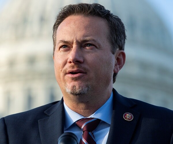 michael cloud stands on capitol steps