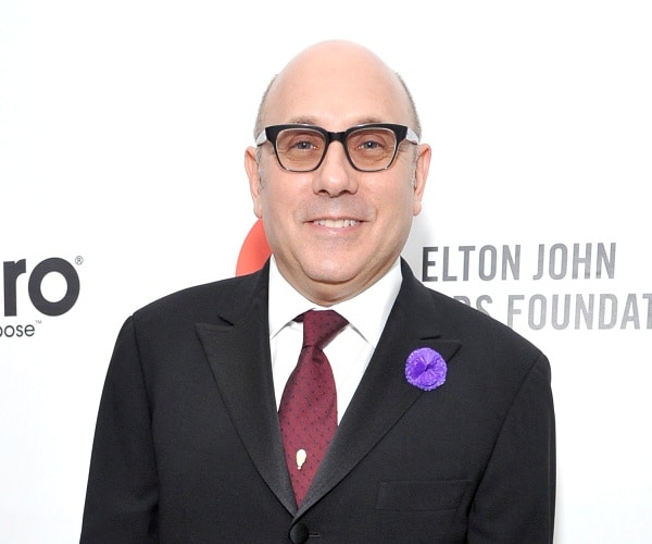 willie garson stands on red carpet