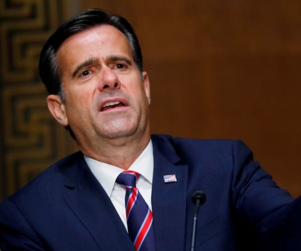 ratcliffe in a suit and red and blue striped tie