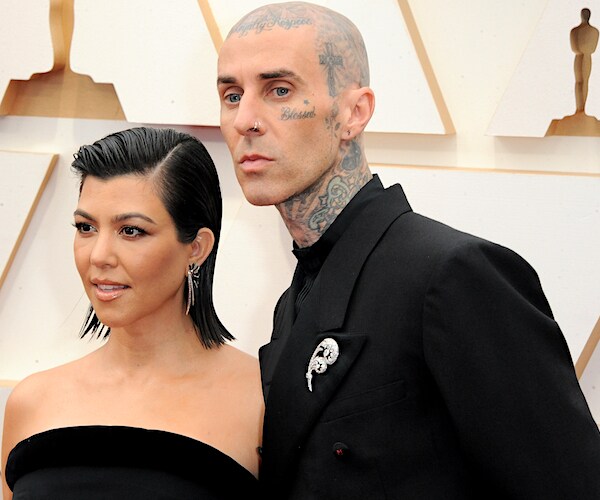 Kourtney Kardashian and travis barker appear on the red carpet