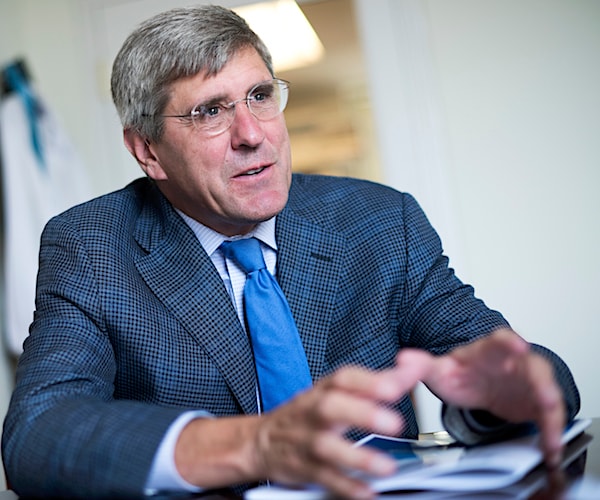 stephen moore sits and explains economic concepts during a media interview