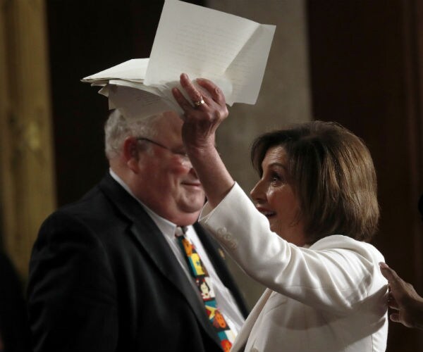 House Nancy Pelosi holds up her torn copy of Trump's State of the Union address in the House chamber 