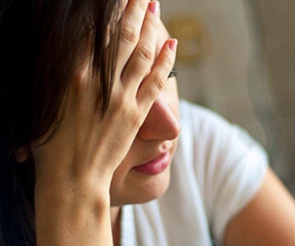 woman looking sad, anxious