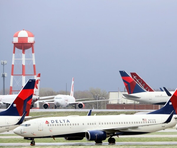 delta planes sit outside an airport