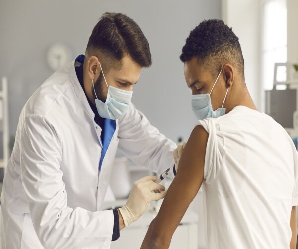 Young man receiving Covid vaccine