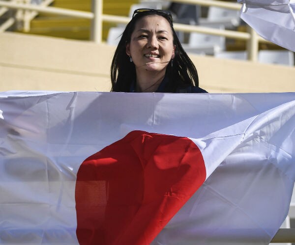 woman holding japan's flag