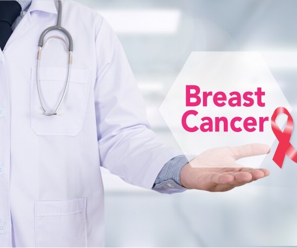 image of doctor holding 'breast cancer' sign