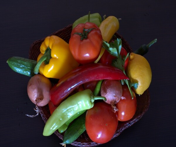 A big plate with lots of different whole vegetables