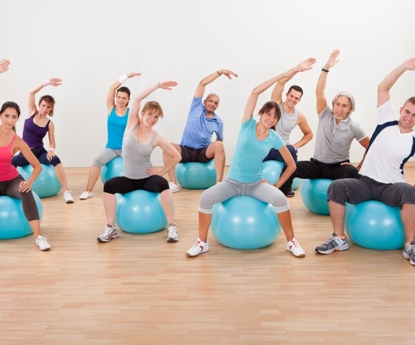 men and women in Pilates class