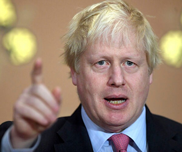 boris johnson points and speaks during a news briefing at ten downing street