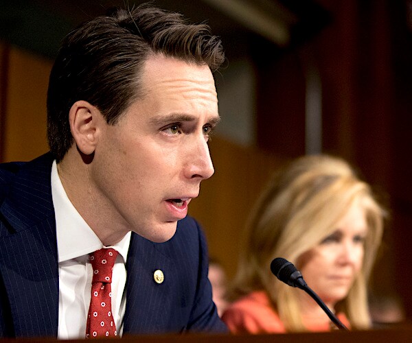 josh hawley speaks before a senate committee hearing