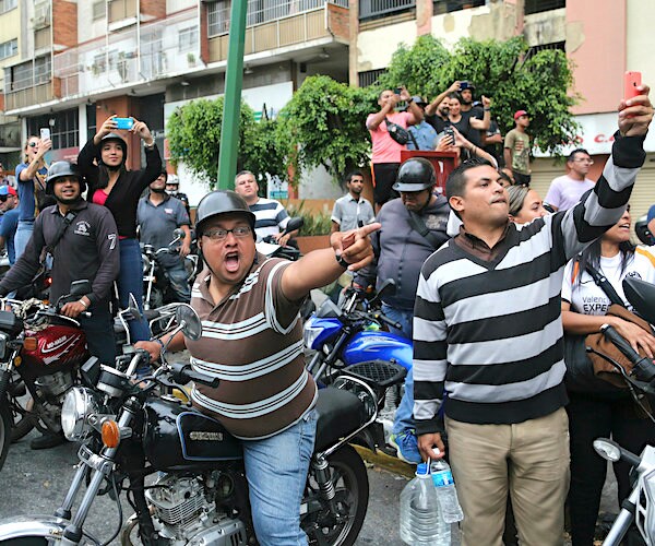 venezuelans protest outside of the government offices in caracas