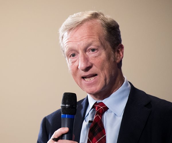 tom steyer speaking into a microphone