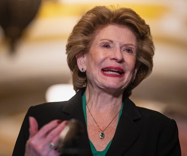 Debbie Stabenow gestures while speaking