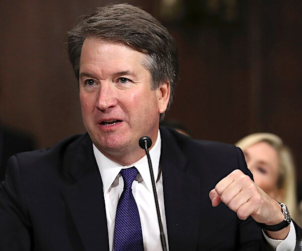 brett kavanaugh pumps his fist during a senate confirmation hearing