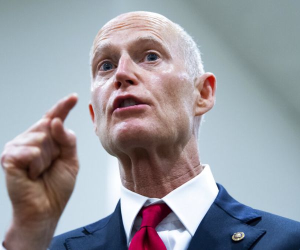 rick scott points and speaks during an impassioned address to the media