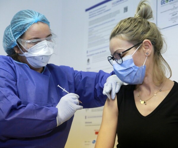  A woman receives the COVID vaccine 