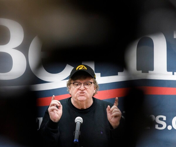 michael moore speaks at an event for bernie sanders