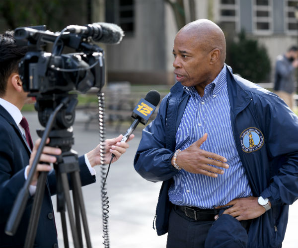 Brooklyn Borough President Eric Adams  is shown doing an interview.