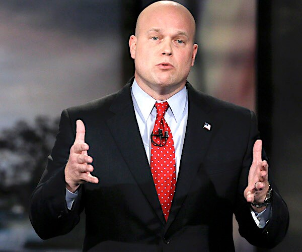 active attorney general matthew whitaker gestures with his palms of both face each other vertically