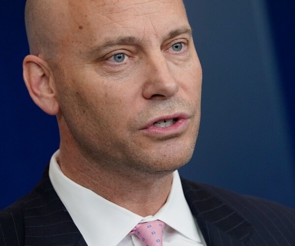 marc short in a suit and light pink tie