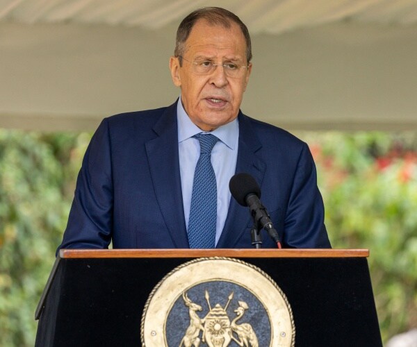 sergei lavrov speaks into a microphone