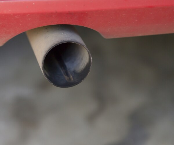 smoke coming out of the tailpipe of a car