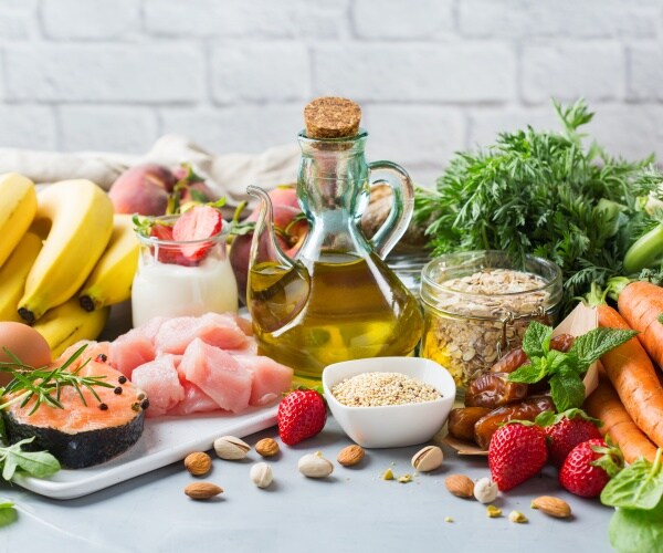 foods in Mediterranean diet including fruits, vegetables, fish, olive oil, whole grains