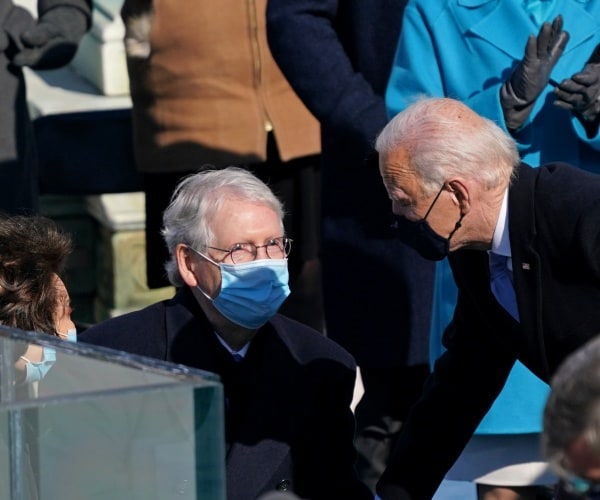 joe biden leans in to speak with mitch mcconnell