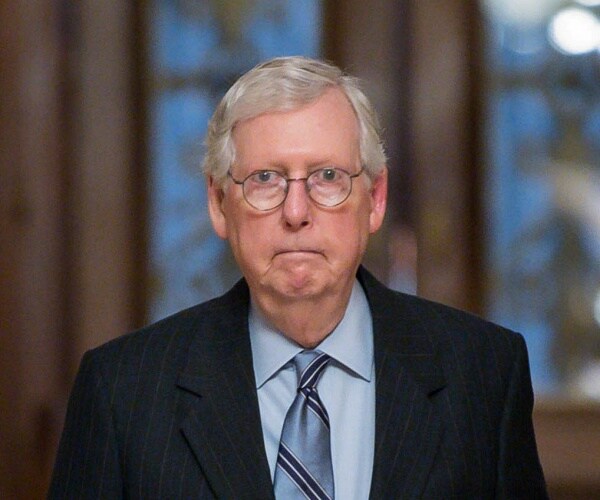 mitch mcconnell walks through capitol