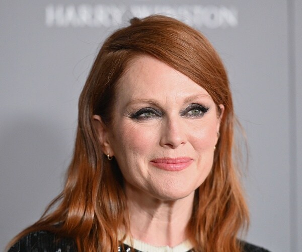 julianne moore stands on red carpet