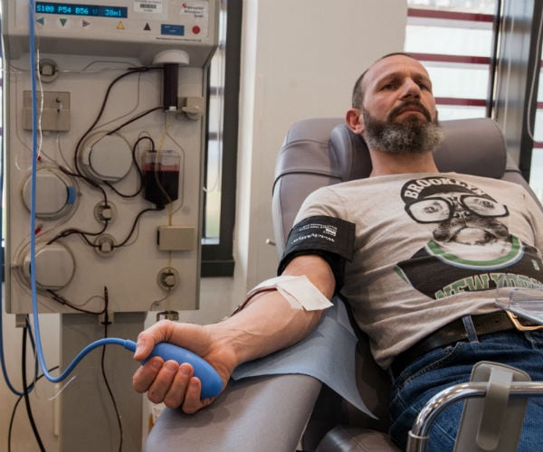 a man is shown donating blood