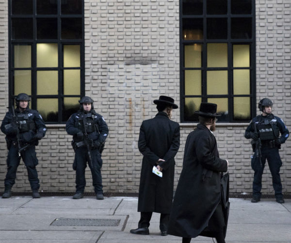 officers are seen on guard outside a brooklyn synagogue in new york