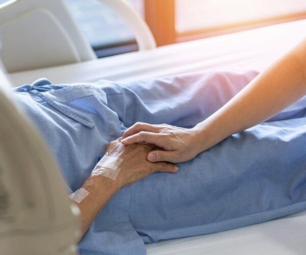 older man in hospital bed