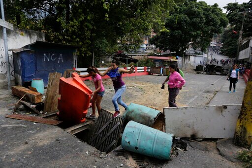 The Latest: Pence Calls Maduro a 'dictator' in Video Message