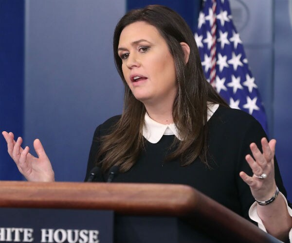 sarah sanders speaks to reporters in the white house