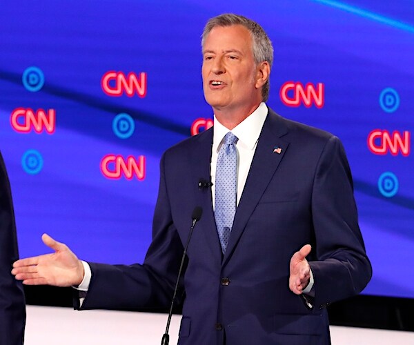 bill de blasio gestures while he speaks during a democratic presidential primary debate