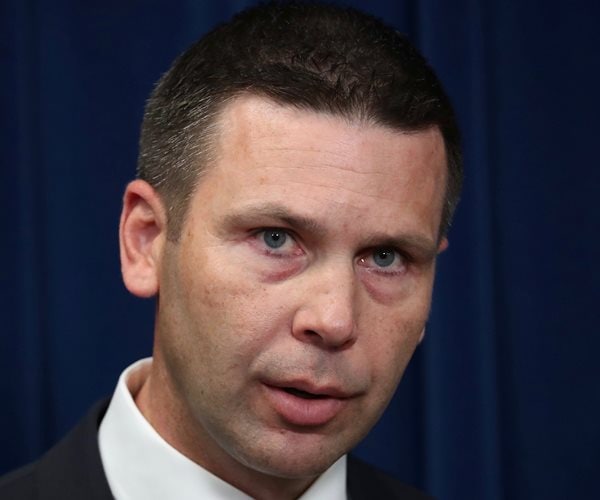 kevin mcaleenan at a poduim in washington dc