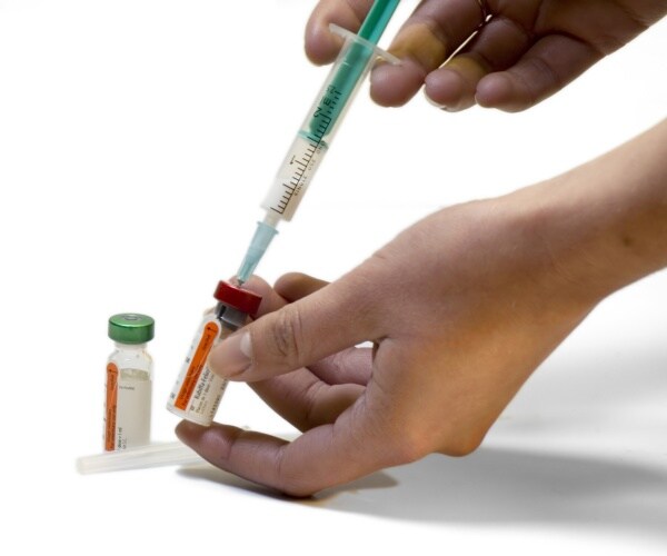 bird flu vaccine in vial, syringe