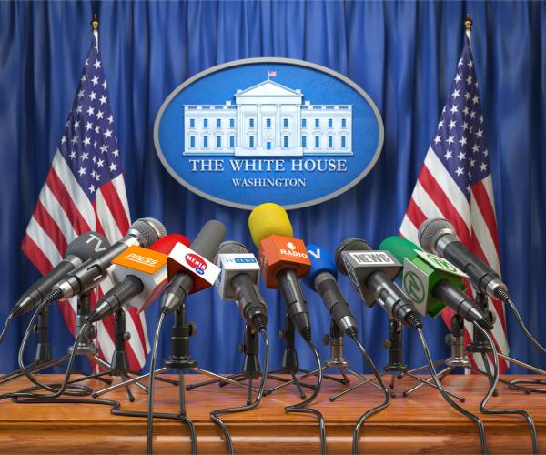 a mockup of the white house press briefing room with mutiple media microphones