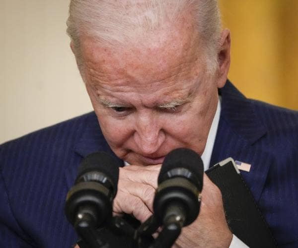 biden at podium looking down