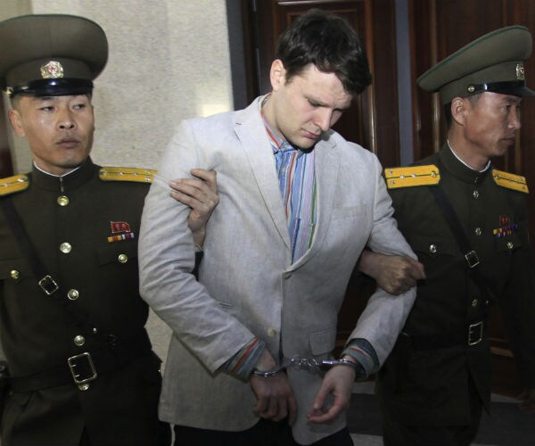 north korean guards with otto warmbier