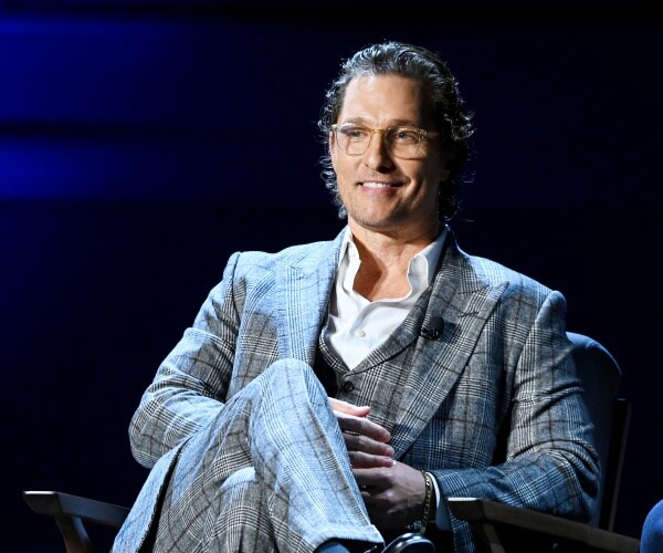 matthew mcconaughey sits onstage