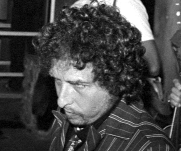 a curly haired bob dylan in 1982