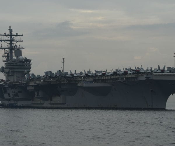 uss ronald reagan is shown anchored off manila bay