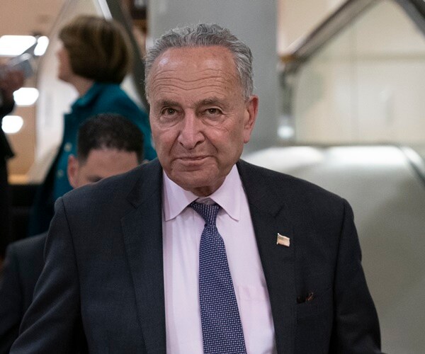 chuck schumer gets off of escalator in the capitol