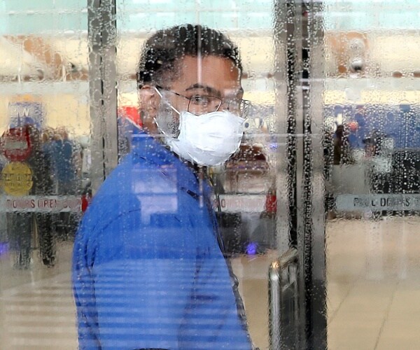 man wearing protective mask and eyeglasses