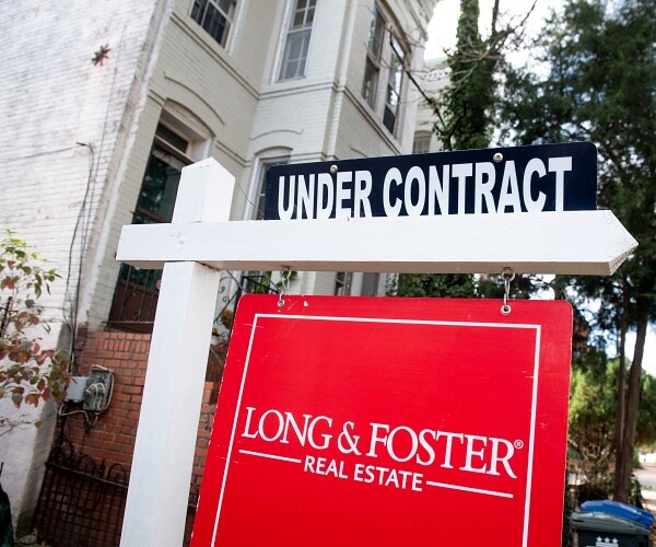 under contract sign in front of house