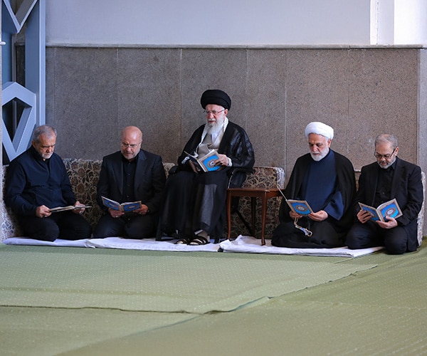 religious figures and or leaders of a middle eastern nation in prayer