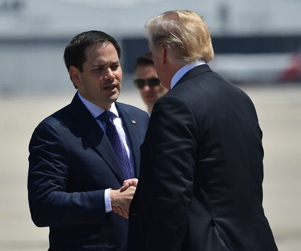 sen,. marco rubio shakes president donald trump's hand on the tarmac at miami airport